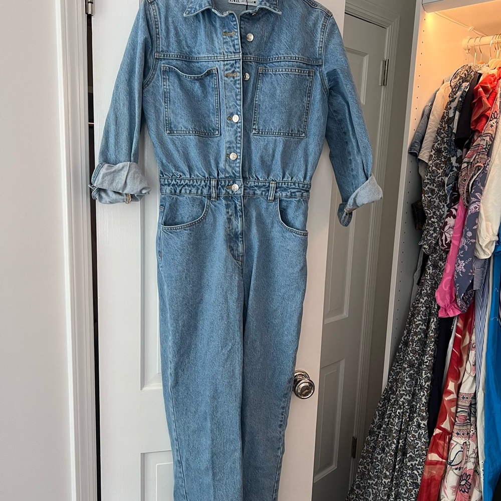 Zara Light Blue Denim Jumpsuit fits more like a medium